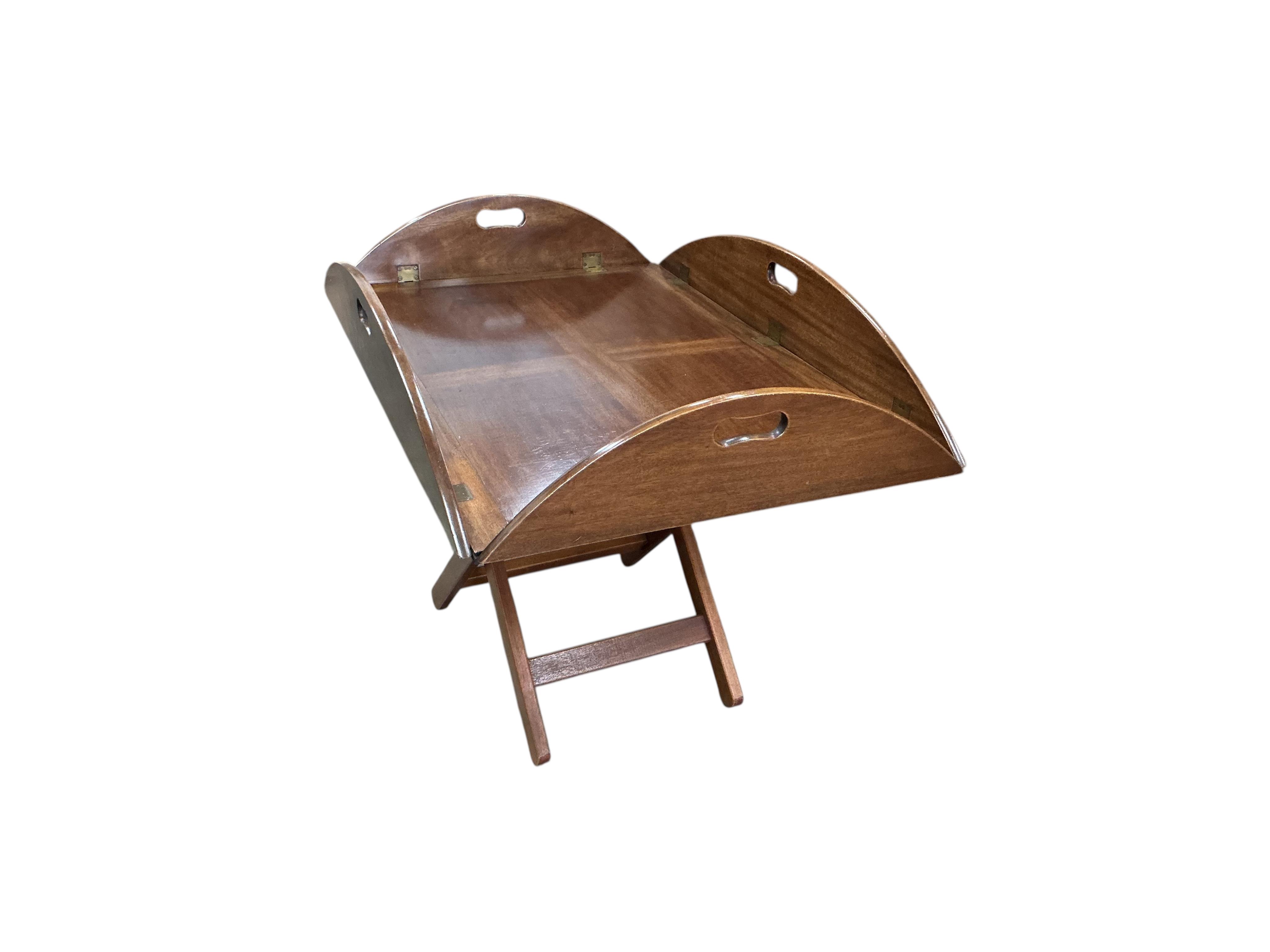 A reproduction George III style mahogany butler's tray / occasional table on folding stand, width 94cm, depth 64cm, height 65cm
